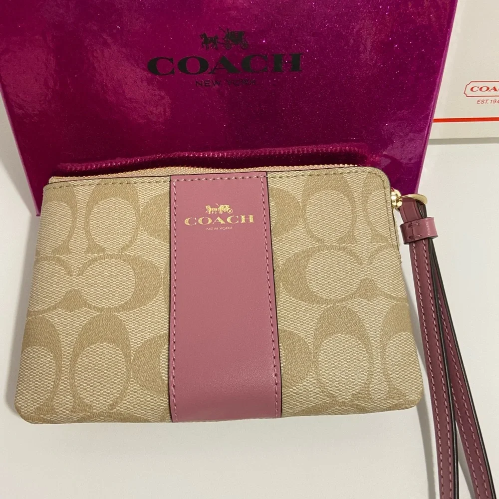 COACH WRISTLET WITH C-SIGNATURE COACH ON IT AND WITH A PINK STRIPE ON FRONT. - Picture 3 of 8